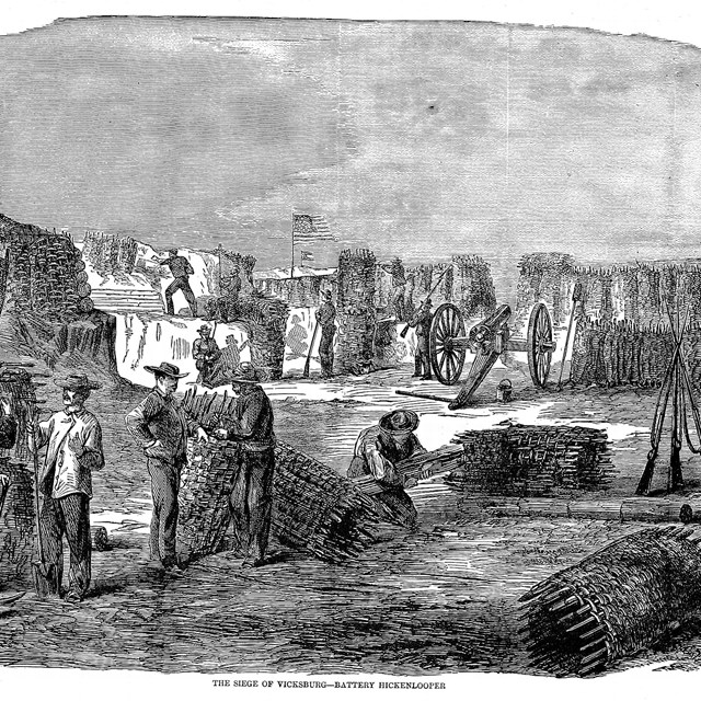 A black and White Illustration depicts workers preparing items for siege